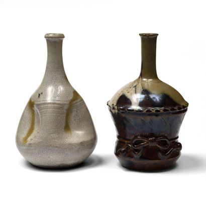null JAPAN Two stoneware sake bottles, one pear-shaped with a flattened body in four...