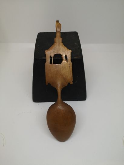 null Wooden communion spoon with a religious scene on the handle