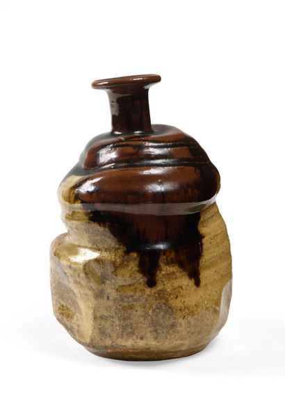 null JAPANese stoneware sake bottle of deformed ovoid shape, flattened in the center...