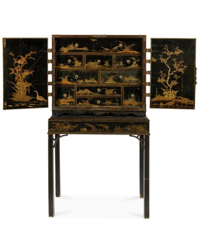 null Small cabinet decorated in imitation of Japanese gold lacquers on a black background...