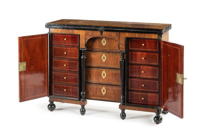 null The rectangular top of the bureau de changeur is inlaid with coral wood decorated...