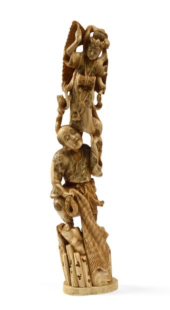 null JAPANese carved ivory okimono representing a fisherman resting on a rock topped...