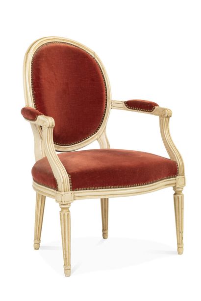 null Armchair with a cabriolet medallion back in moulded and cream varnished beechwood;...
