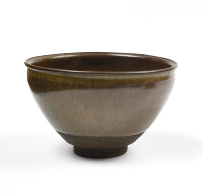 null JAPANese stoneware tea ceremony bowl of hemispherical shape covered with a brown...