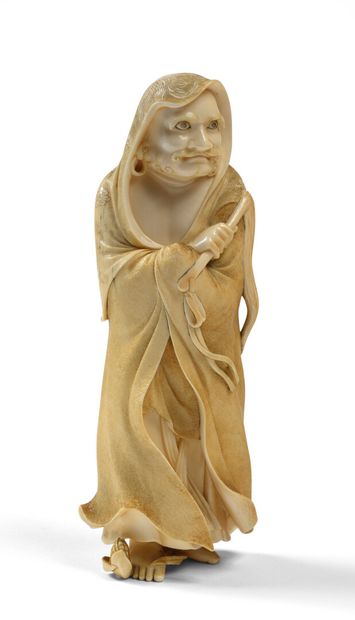 null JAPAN Carved ivory figurine representing Daruma standing with his head covered...