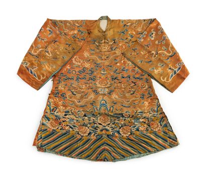 null CHINA - 19th century 

Orange silk jacket embroidered with gold and polychrome...