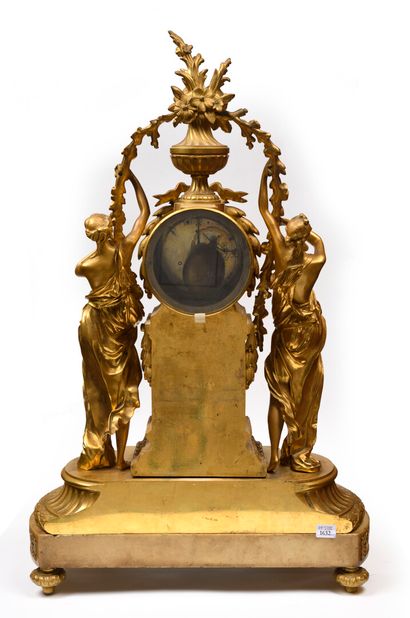 null Chased and gilt bronze clock; the movement inscribed in a circular case resting...