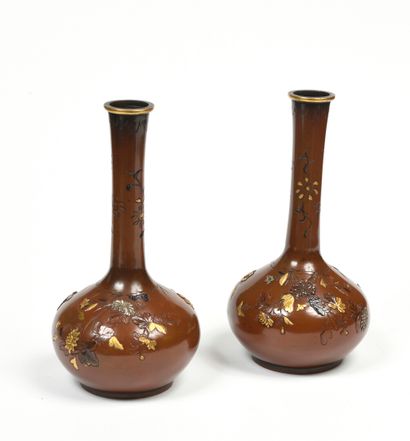 null JAPAN A pair of long narrow necked patinated copper vases with bird and flowering...