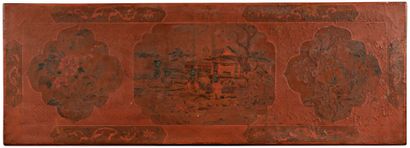 null CHINA - 17th century

A red and brown lacquered wood console decorated with...