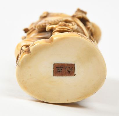null JAPANese carved ivory okimono representing a putai surrounded by children and...