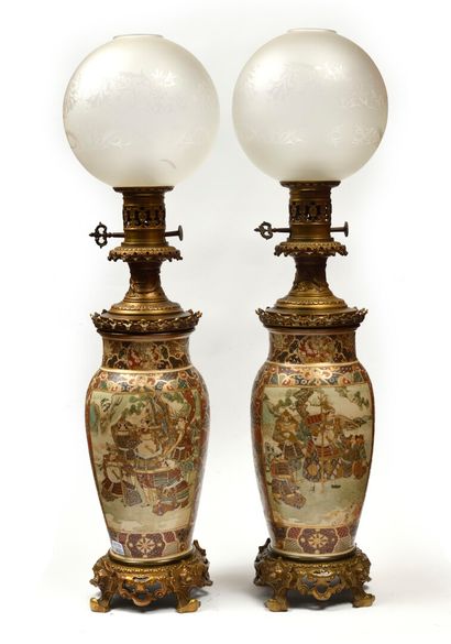null JAPAN SATSUMA Pair of earthenware vases, mounted as oil lamps, with polychrome...