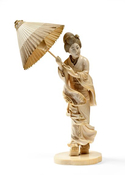 null JAPAN Large carved ivory figure of a standing Bijin holding an open parasol....
