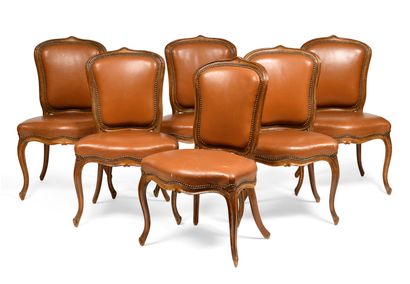 null A set of six cabriolet chairs in molded and carved beechwood; the backs and...