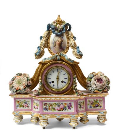 null PARIS ATTRIBUTED TO JACOB PETIT Porcelain clock resting on 9 feet decorated...
