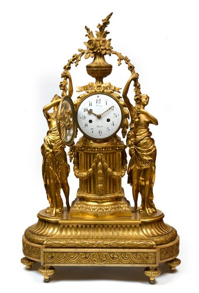 null Chased and gilt bronze clock; the movement inscribed in a circular case resting...