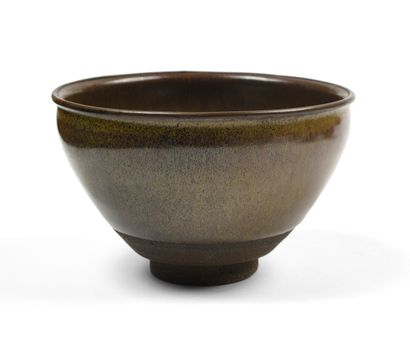null JAPANese stoneware tea ceremony bowl of hemispherical shape covered with a brown...
