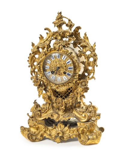 null Gilt bronze rocaille clock decorated with a garland of roses and foliage

Louis...