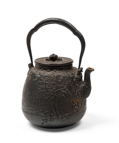 null JAPANese cast iron kettle (tetsubin) decorated with a landscape and kanji. Signed...