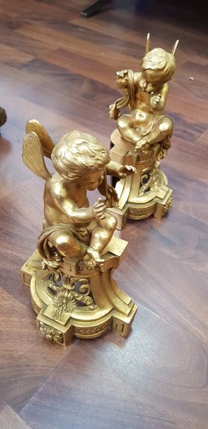 null A set of andirons with winged putti on Louis XVI style gilt bronze bases

Height...