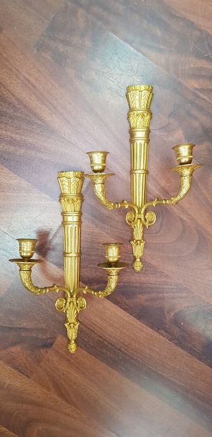 null A pair of ormolu sconces with two arms, the shafts representing quivers

Height...