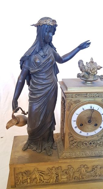 null A large gilt bronze clock with a vestal on the base decorated with a frieze...