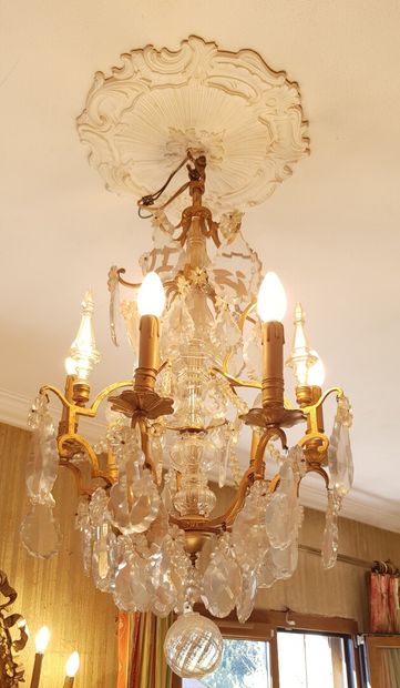 null A 6-light gilded metal cage chandelier decorated with daggers and glass beads

Height...