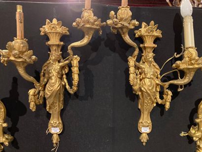 null Pair of sconces with two arms of light decorated with a woman in a sheath holding...