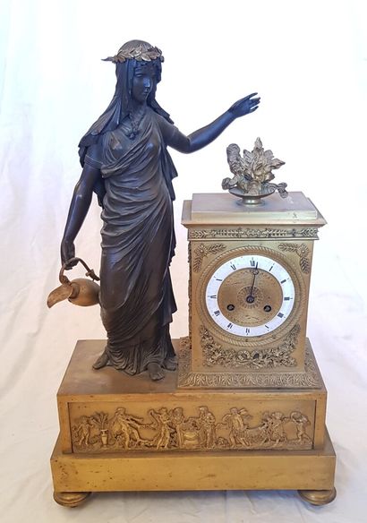 null A large gilt bronze clock with a vestal on the base decorated with a frieze...