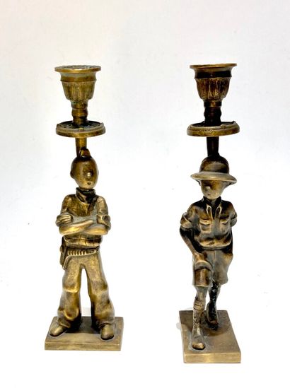 null Deux flambeaux en bronze représentant Tintin au Congo et Tintin en Amérique,...
