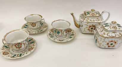 null White porcelain tea and coffee set decorated with polychrome flowers and gold...