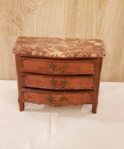 null Small miniature chest of drawers opening to three drawers in light wood marquetry...