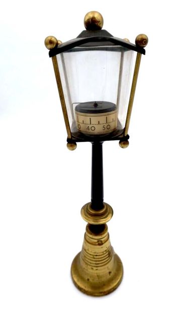 null Set of two clocks : 
Brass clock Bird in cage.
Clock with lantern in the shape...