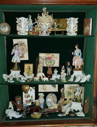 null Set of display items including bisque or porcelain shoes, porcelain groups,...