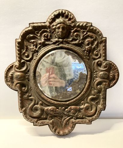 null Mirror in embossed and patinated sheet metal with neo-Renaissance decoration...