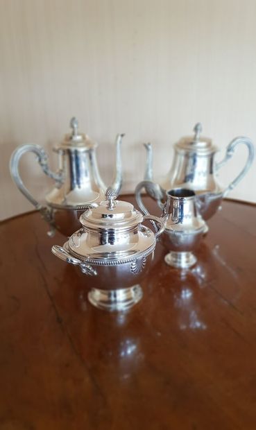 null Four-piece silver plated tea service with pearl and shell decoration