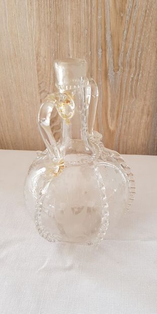 null Glass bottle blown and spun with vine branches, bird and mill.
Holland 18th...