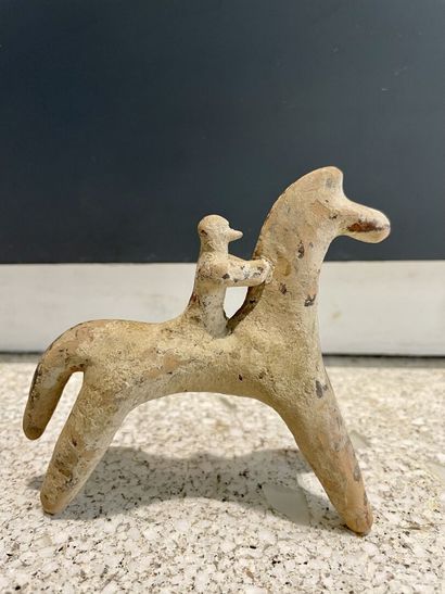 null Stylized horseman figurine.
Beige terracotta. Reglued figure. Wear, earthy deposit.
Boeotia,...