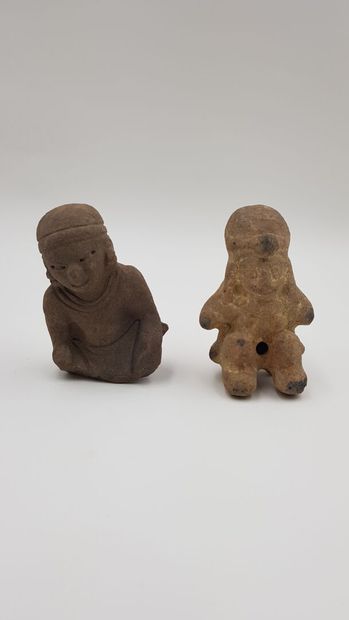 null Jama queques, ECUADOR
Two figures in pink and brown terra cotta depicting richly...