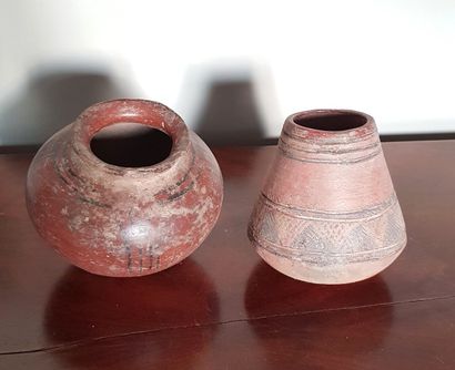 null Two ceramic vases decorated with concentric circles and a frieze.
Guatemala....