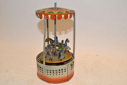 null GERMANY manufacturer of the 20's: mechanical carousel with three horses with...