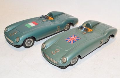 null BANDAI (2) Ferrari cars, friction, in green water sheet, one with English flag...