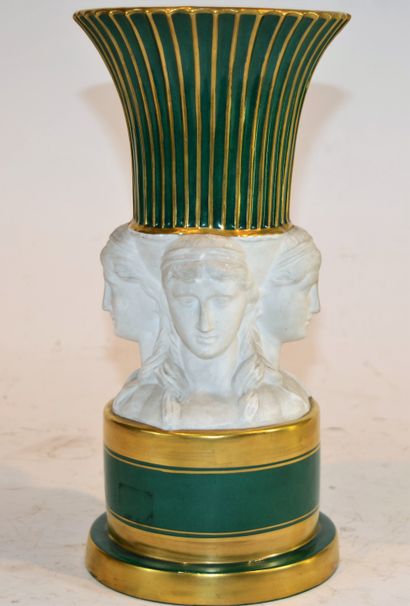 null PARIS: porcelain vase resting on four caryatid heads, green and gold, porcelain...