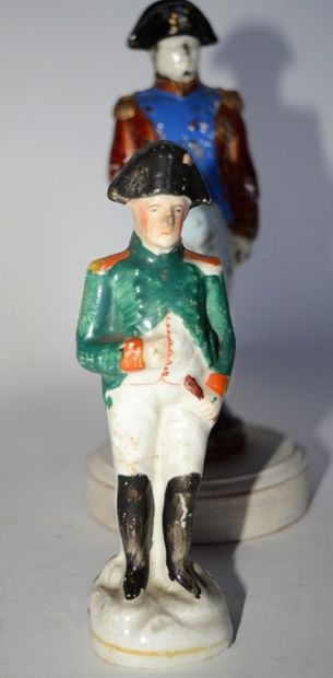 null two statuettes of Napoleon:

-one in painted glass, height: 16 cm (many chips...