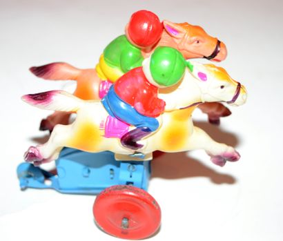 null Two mechanical race riders. Celluloid characters. Length: 9 cm, height: 7 c...
