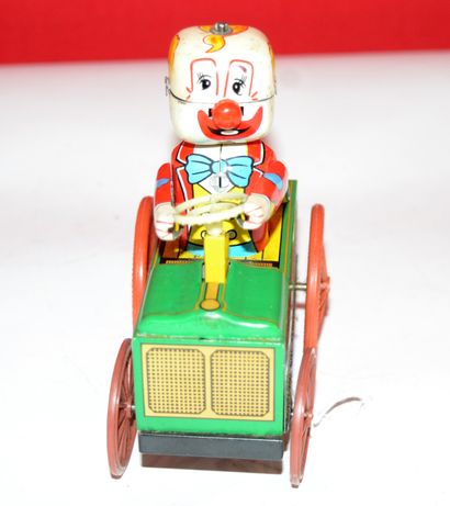 null Japon: Yone "Crazy clown"

voiture en fer blanc lithographié, roues en plastique....