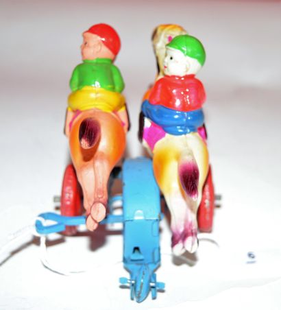 null Two mechanical race riders. Celluloid characters. Length: 9 cm, height: 7 c...