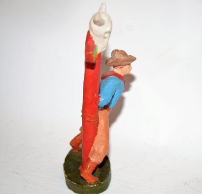 null "NF-ITALIA": Cowboy in composition attached to an Indian totem. Height: 11.5...