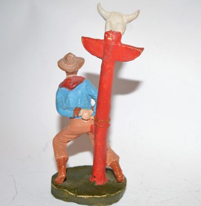 null "NF-ITALIA": Cowboy in composition attached to an Indian totem. Height: 11.5...