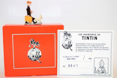 null PIXI: Tintin Snowy "the broken ear". Red box with illustrated background. 1988,...