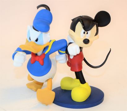 null Mickey and Donald in resin. Missing an ear to mickey, Donald without base. Height:...